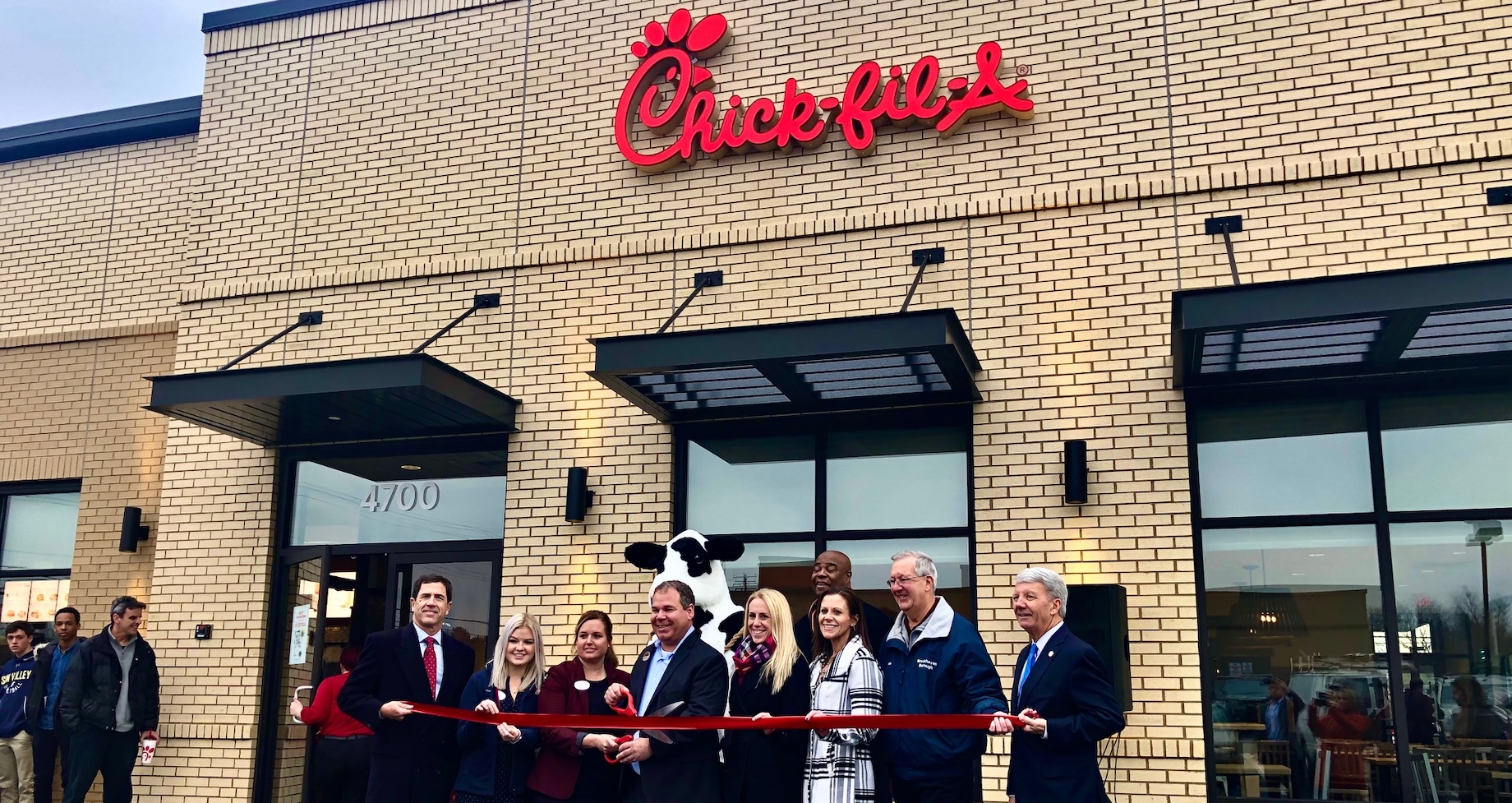 Retail Sites’ Morgan Hill Konstantinidis, fifth from the right, joined stakeholders at the December 2019 ribbon cutting for a