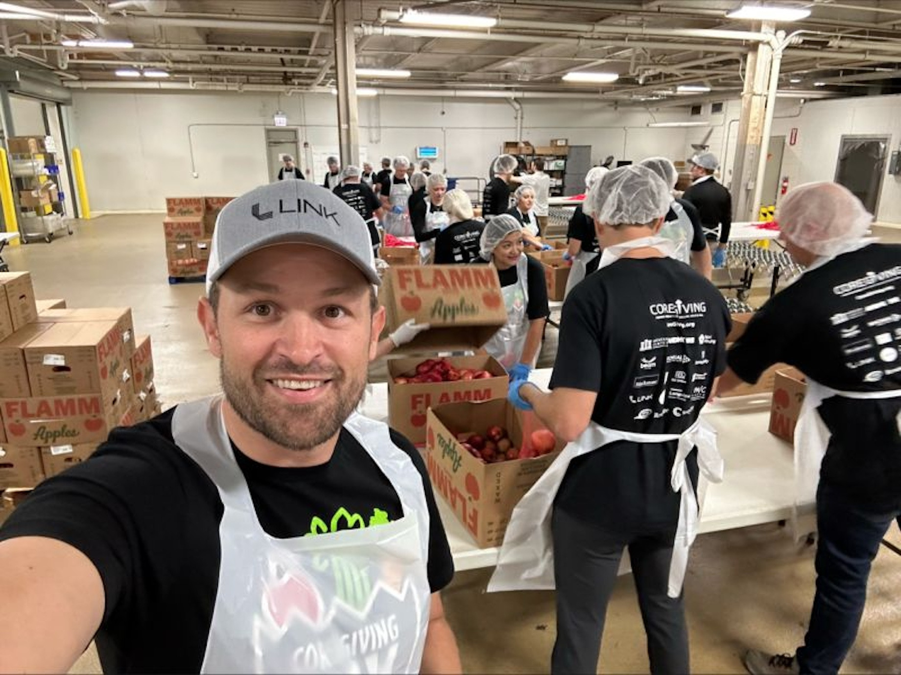 Link Logistics and Blackstone employees volunteered to sort, pack and distribute food donations.